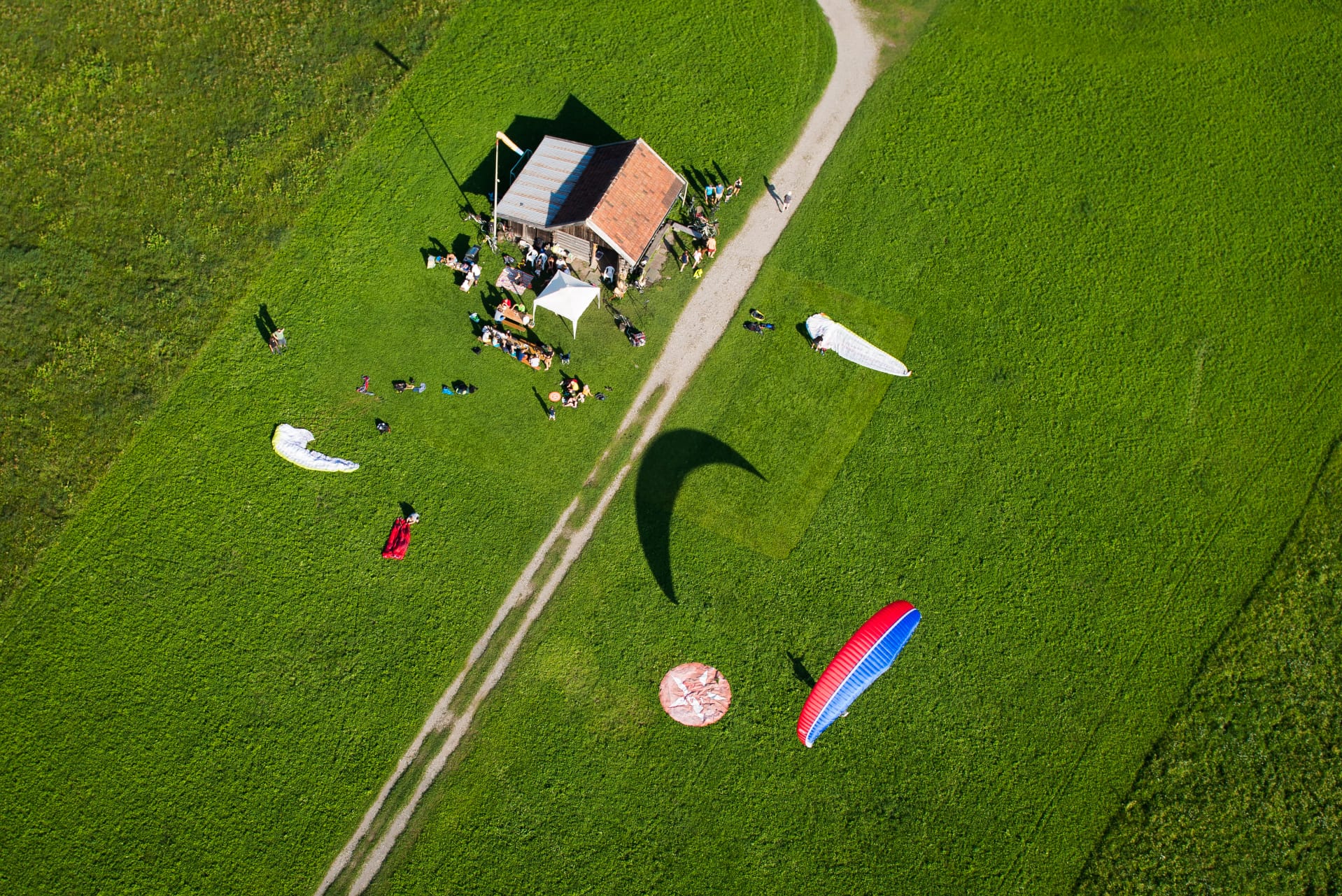 Landing field with parked paragliders